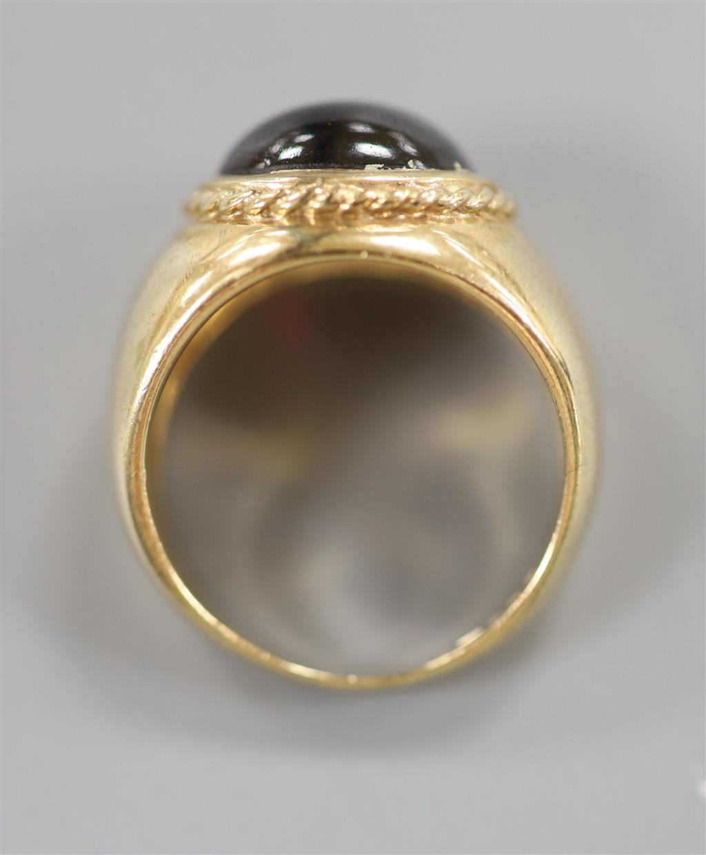 A 1970s Victorian style 9ct gold and cabochon garnet set dress ring, size I/J, gross 4.8 grams.